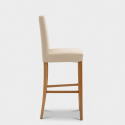 Sgabello alto in ecopelle con gambe in legno Judit